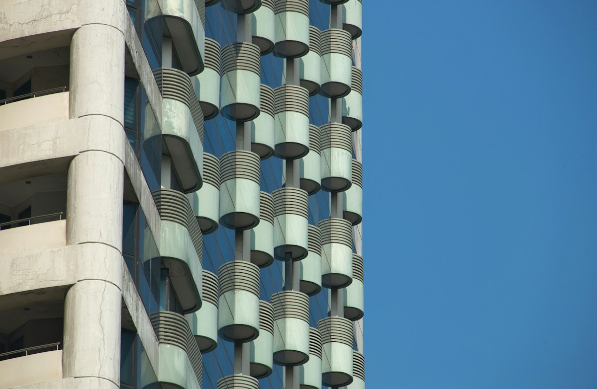 Modern building facade with geometric pattern against blue sky in the Philippines