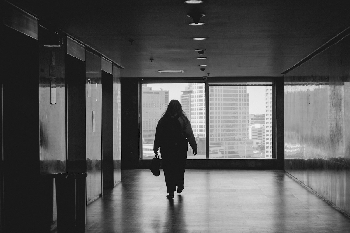 A person walking down a hallway in a building in the Philippines